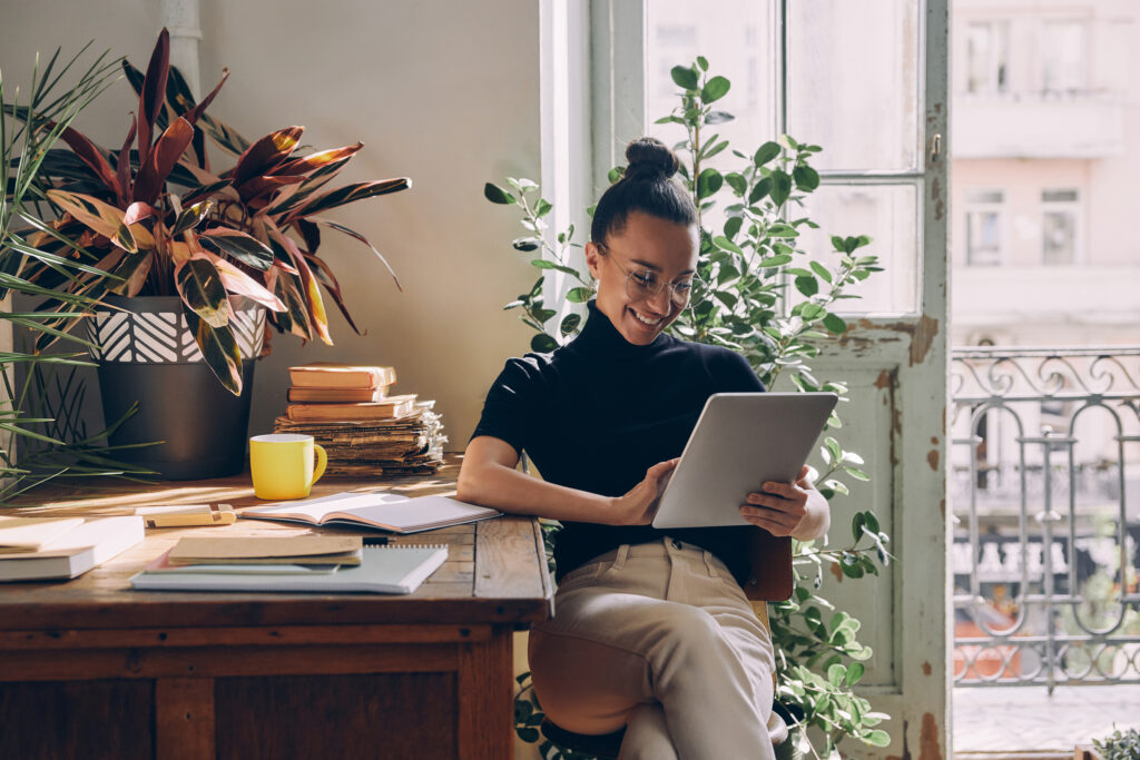 Professional mortgage advisor analyzing home loan options on a laptop in a comfortable, inviting office setting, Refinance Home Loan