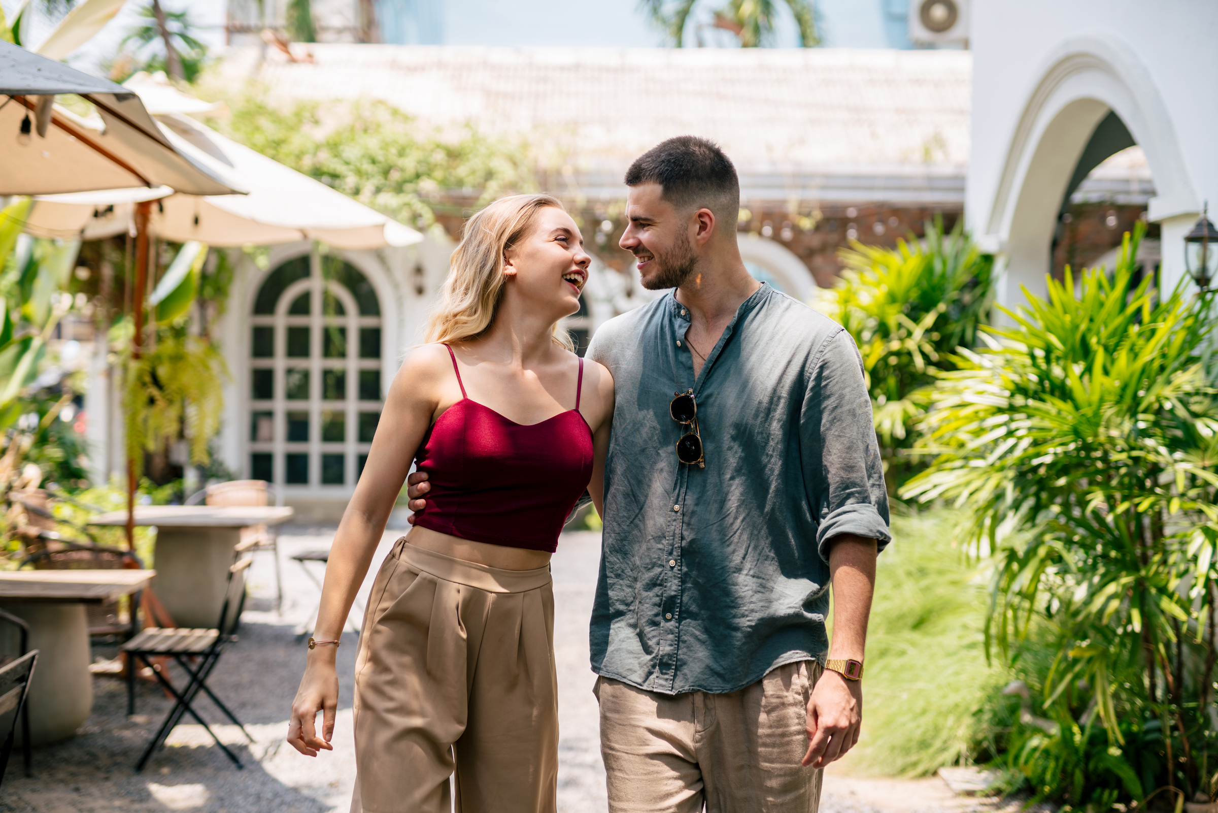 Happy couple walking together after closing on their new home loan.